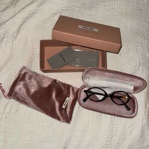 Miu Miu oval eyeglasses tortoise